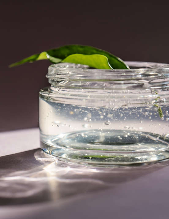 Jar with leaf on top showcasing EcoSynthetix personal products
