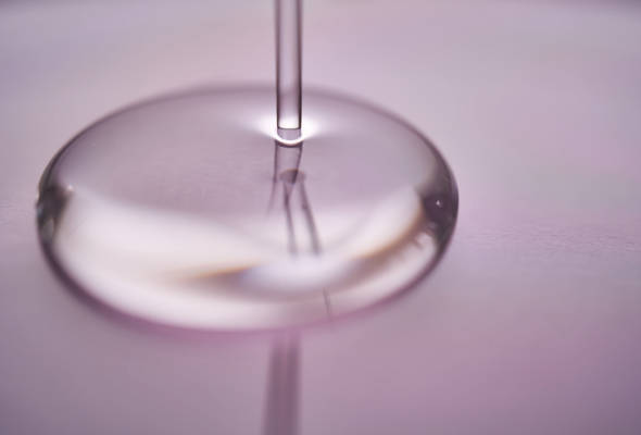 Personal care product being poured on surface.